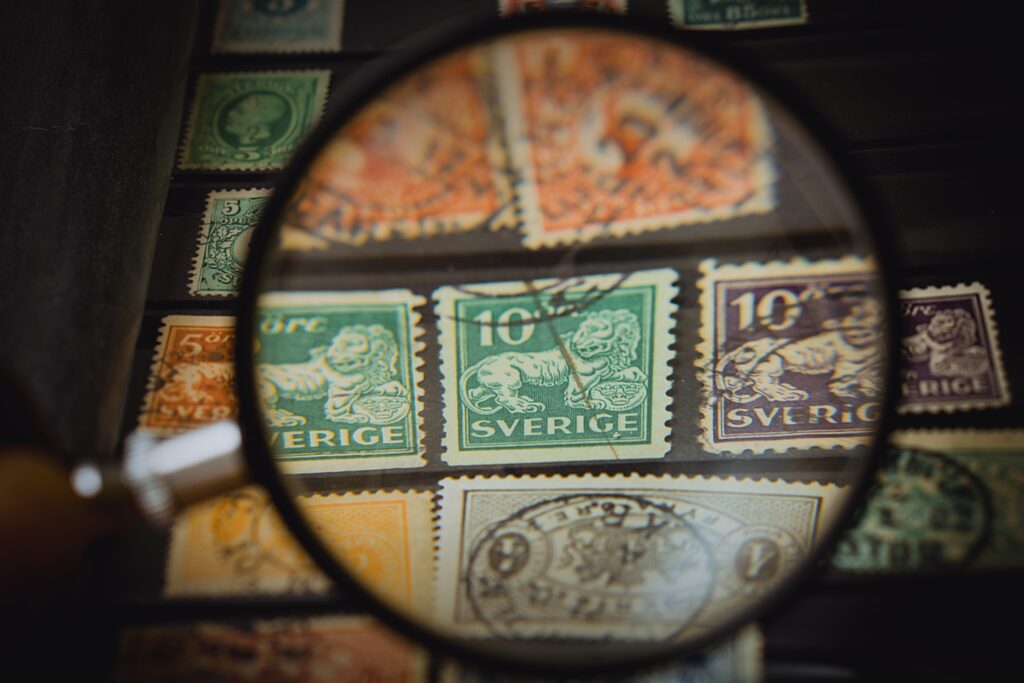vintage stamps under a magnifying glass 