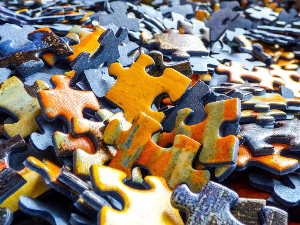 A pile of jigsaw puzzle pieces