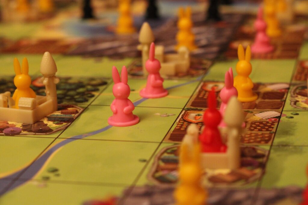 A strategy board game with bunny figures on the board 