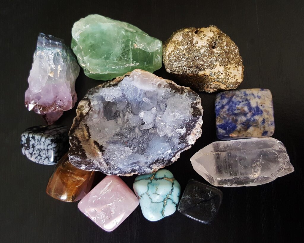 A group of minerals on a wooden surface 